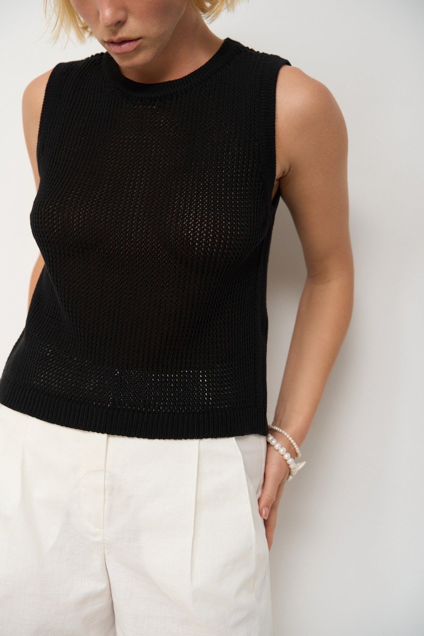 Top made of openwork knitwear