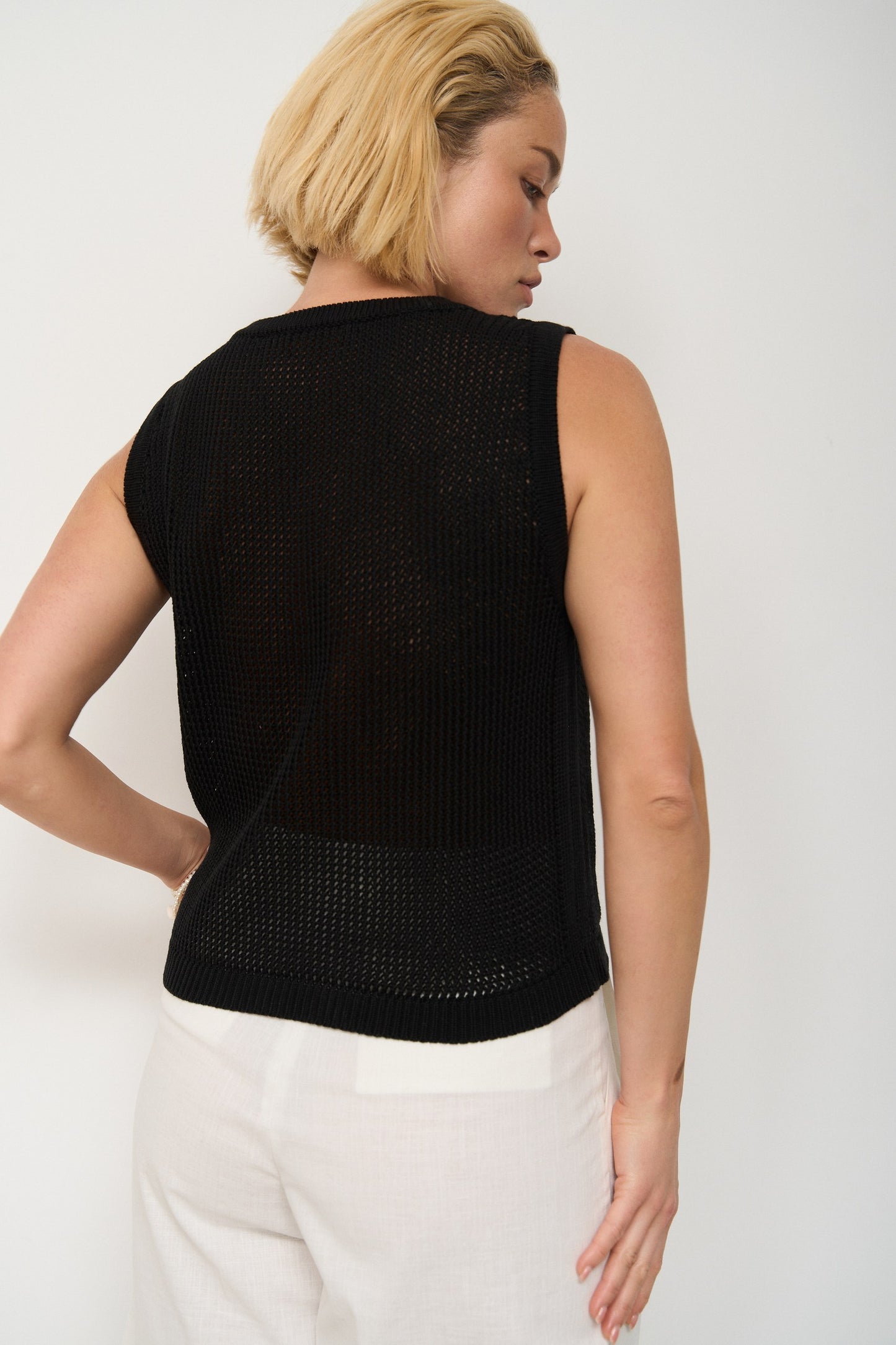 Top made of openwork knitwear