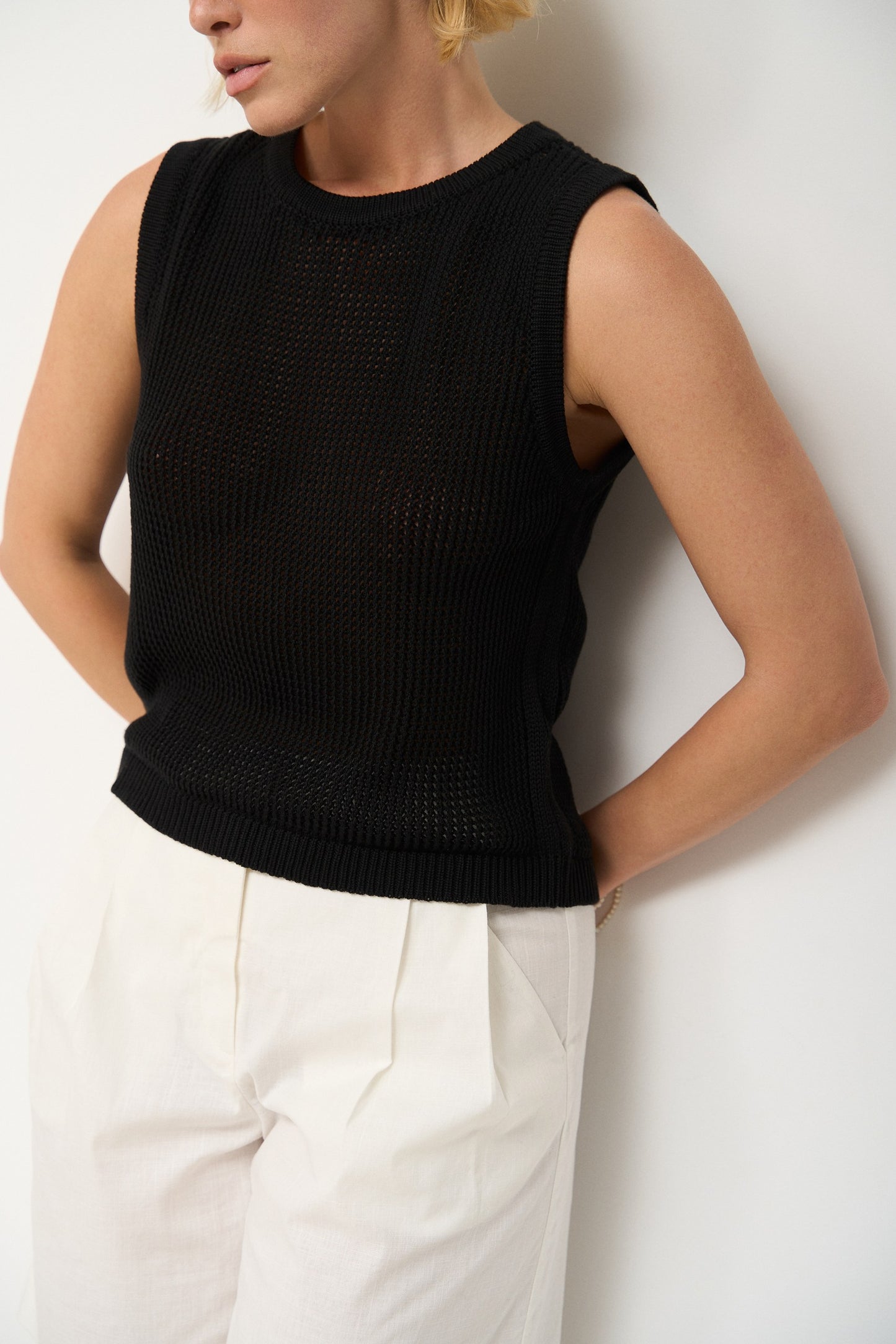 Top made of openwork knitwear